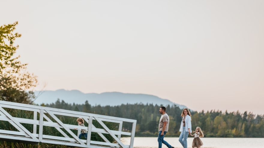 Family on lake dock