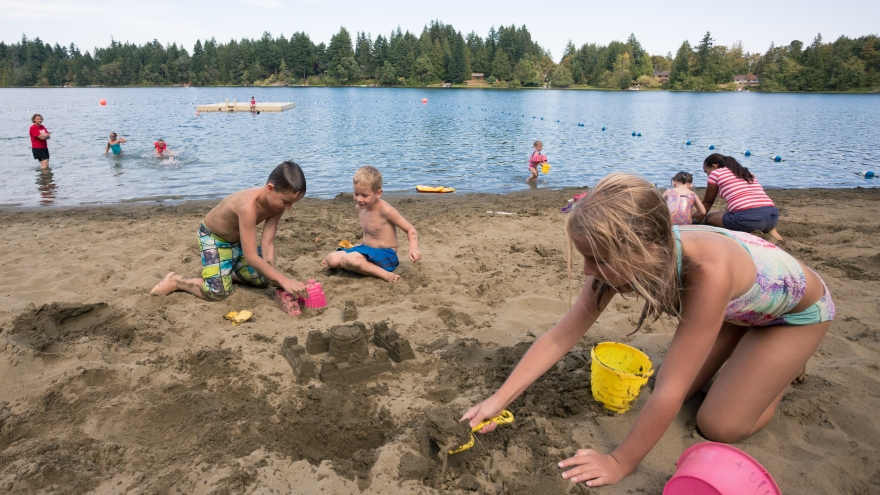 Kids playing in beach sand