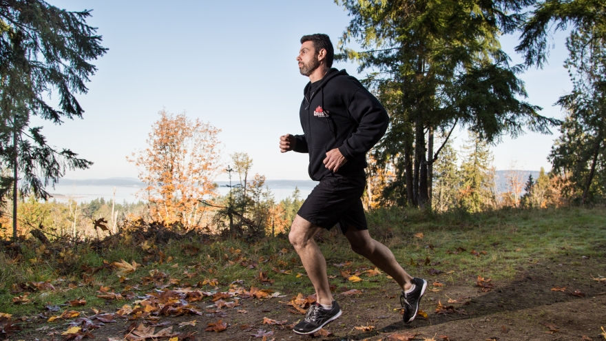 Runner on wooded trail