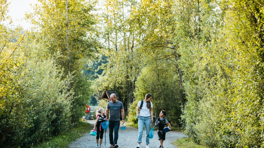 Family walking on wooded trail