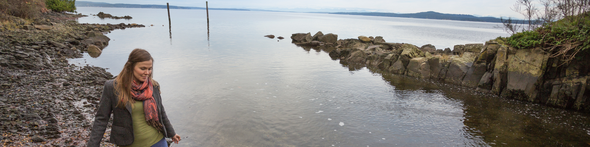 Woman walking by the ocean