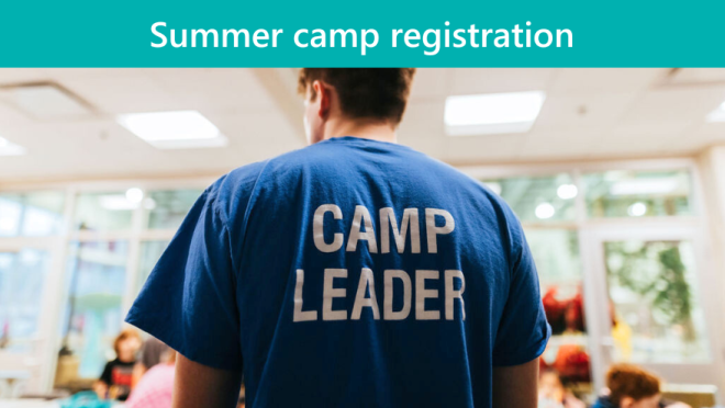 Camp leader leading children at summer camp