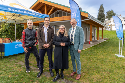 Dignitaries pose in front of new washroom facility at Chemainus' Kin Beach Park