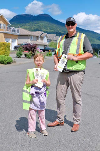 Volunteers handing out Yellow Fish Program flyers
